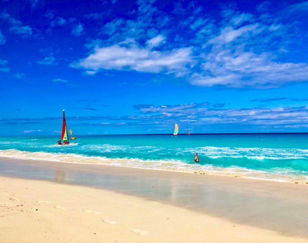 A Beautiful beach is pictured with sand